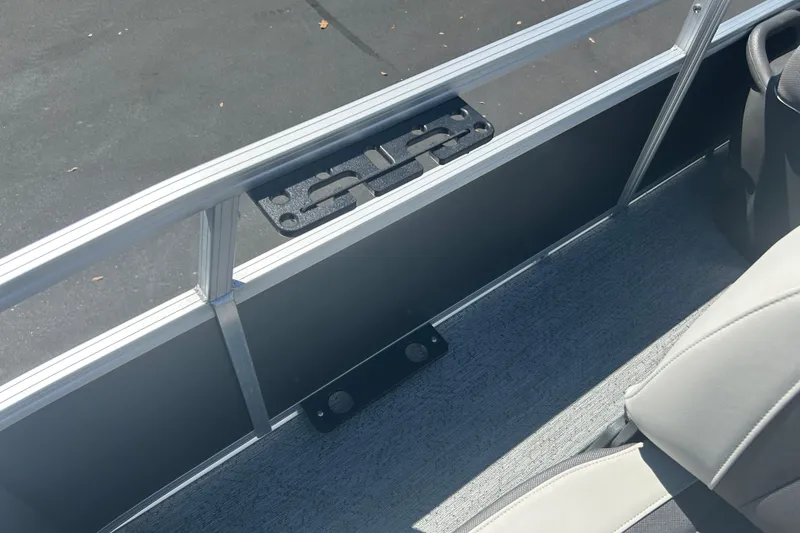 Slide: The Image of 2026 Sun Tracker Bass Buggy 18 DLX interior with seating and railing detail. - 13
