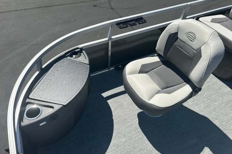 Slide: The Image of 2026 Sun Tracker Bass Buggy 18 DLX pontoon boat interior with seating and storage. - 7
