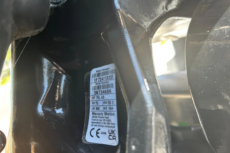 Slide: The Image of Close-up of a Mercury Marine engine label on a 2026 Sun Tracker Bass Buggy 18 DLX. - 112