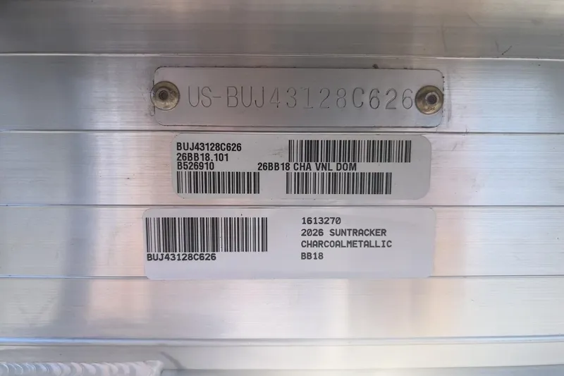 Slide: The Image of 2026 Sun Tracker Bass Buggy 18 DLX identification plate with serial numbers and barcodes. - 111