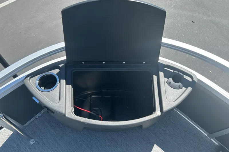Slide: The Image of Open storage compartment on 2026 Sun Tracker Bass Buggy 18 DLX pontoon boat. - 9