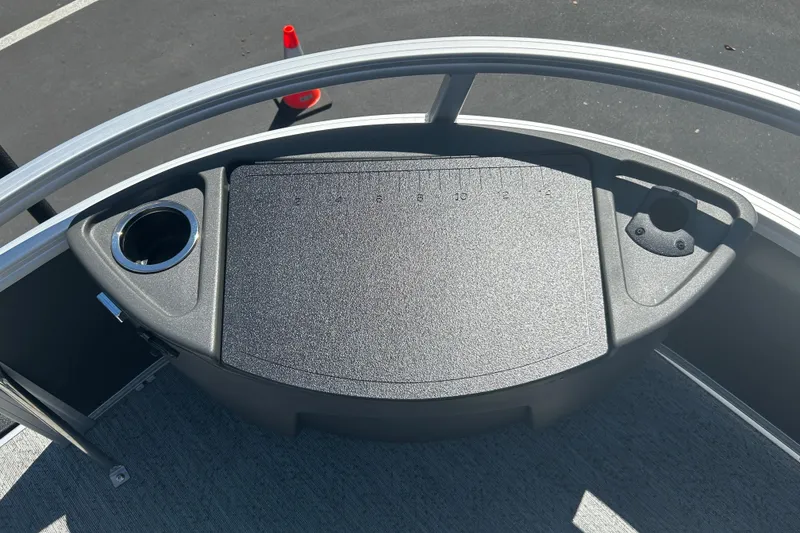 Slide: The Image of 2026 Sun Tracker Bass Buggy 18 DLX boat deck with cup holder and measurement board. - 8