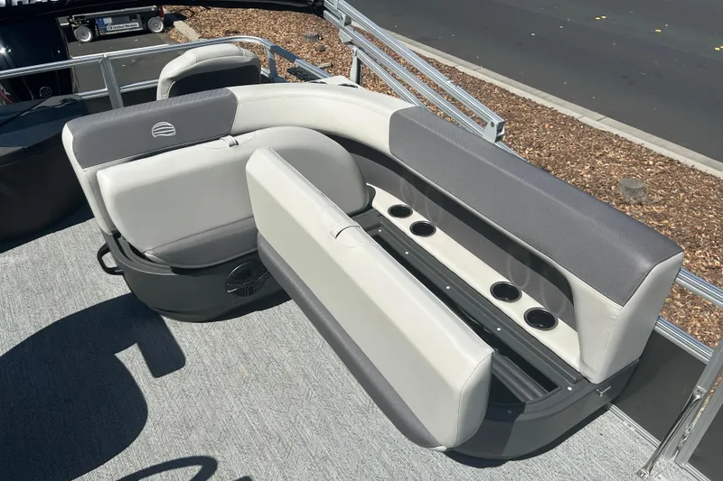 Slide: The Image of 2026 Sun Tracker Bass Buggy 18 DLX pontoon boat seating with cup holders and storage. - 22