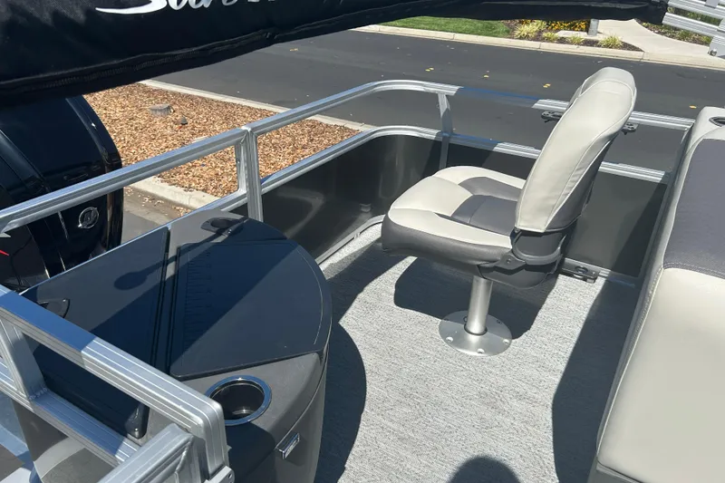 Slide: The Image of 2026 Sun Tracker Bass Buggy 18 DLX pontoon boat interior with seating and console. - 27