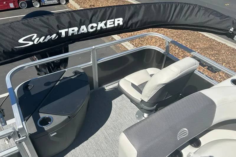 Slide: The Image of 2026 Sun Tracker Bass Buggy 18 DLX pontoon boat interior with seating and storage. - 24