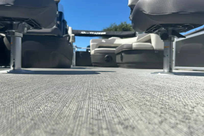 Slide: The Image of 2026 Sun Tracker Bass Buggy 18 DLX interior with seating and textured flooring. - 30