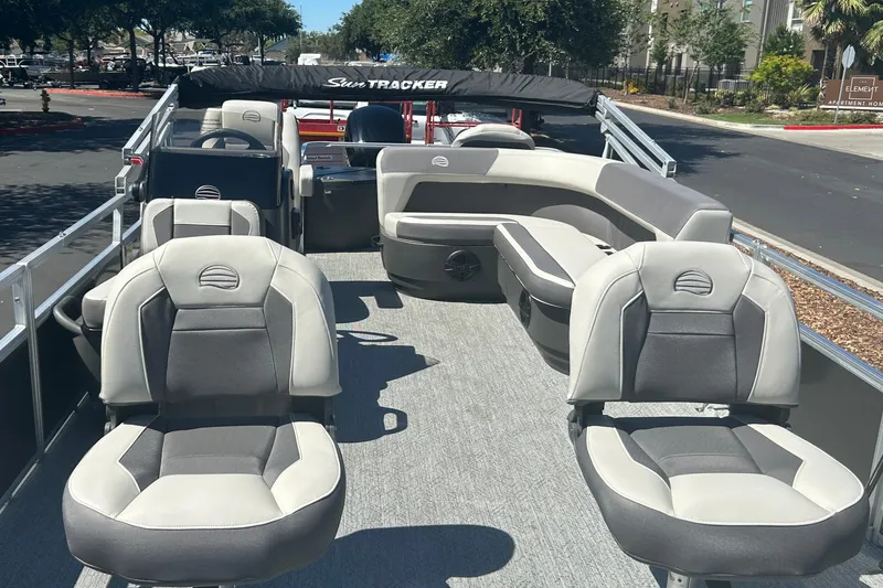 Slide: The Image of 2026 Sun Tracker Bass Buggy 18 DLX pontoon boat with spacious seating and modern design. - 6