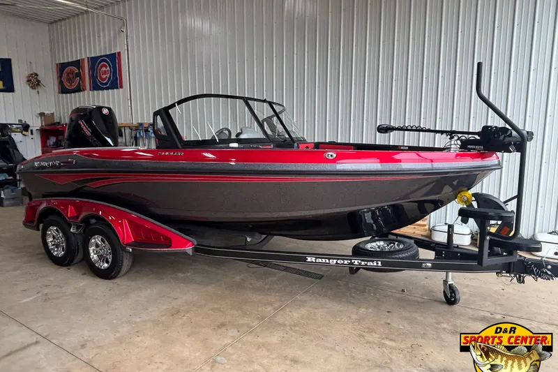 The Image of 2026 Ranger 1880MS boat in showroom, red and black design, on trailer. - 0