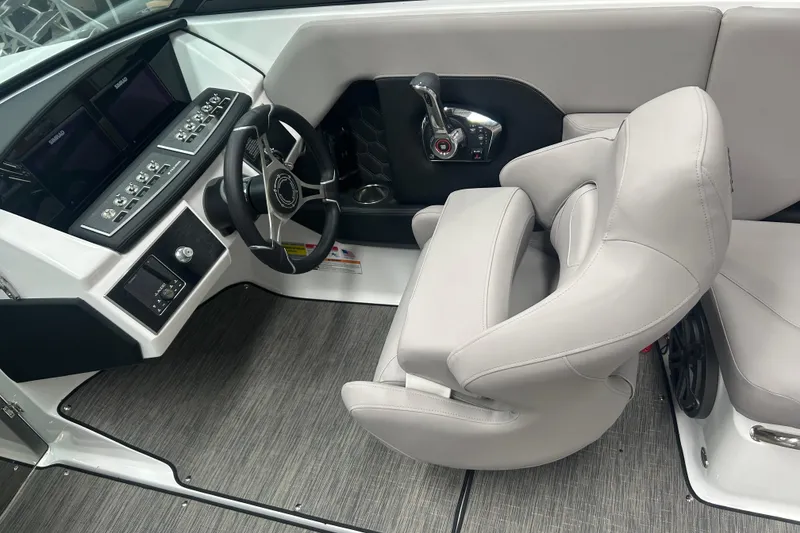 Slide: The Image of 2025 Four Winns H2 boat interior with modern steering and control panel. - 10