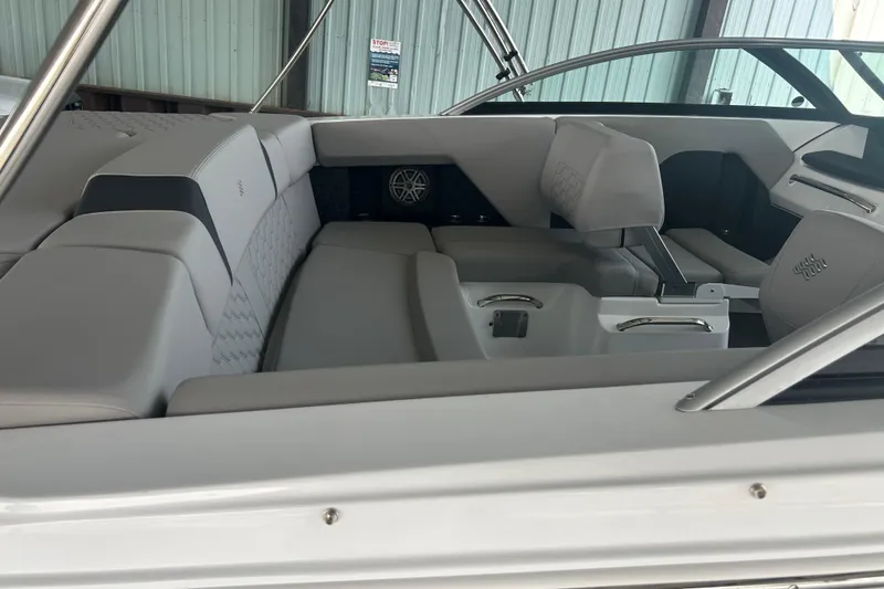 Slide: The Image of Interior of 2025 Four Winns H2 boat, featuring sleek seating and modern design elements. - 5
