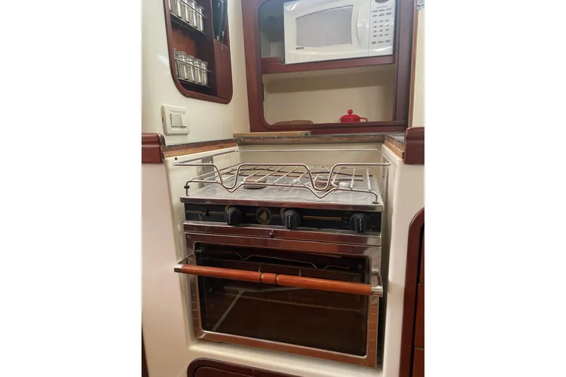 Slide: The Image of Gas stove and microwave in galley. - 9