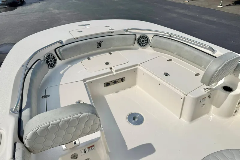 Slide: The Image of 2026 Carolina Skiff 21 Ultra Elite boat interior with cushioned seating and storage compartments. - 13