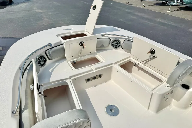 Slide: The Image of 2026 Carolina Skiff 21 Ultra Elite boat interior with open storage compartments. - 14