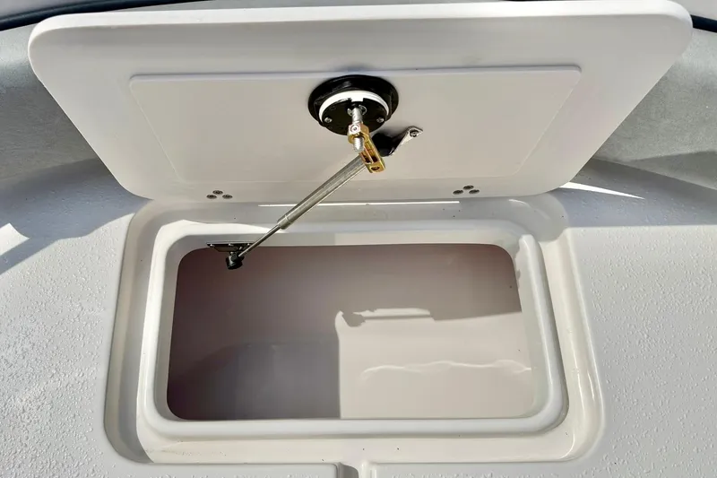Slide: The Image of Open storage compartment on 2026 Carolina Skiff 21 Ultra Elite boat. - 15