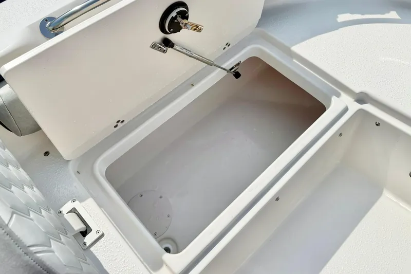 Slide: The Image of Storage compartment on 2026 Carolina Skiff 21 Ultra Elite boat, open and empty. - 17