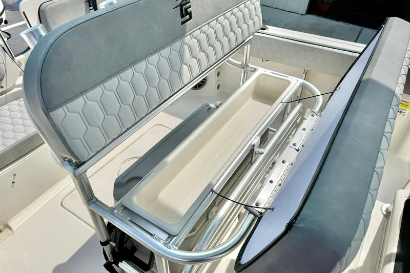 Slide: The Image of 2026 Carolina Skiff 21 Ultra Elite boat seating with storage compartment. - 22