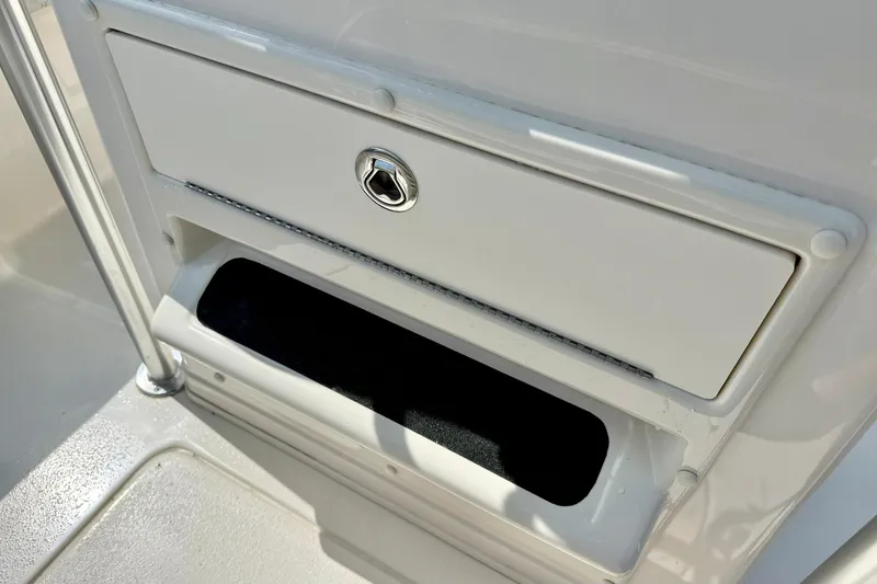 Slide: The Image of 2026 Carolina Skiff 21 Ultra Elite storage compartment with lockable hatch. - 25