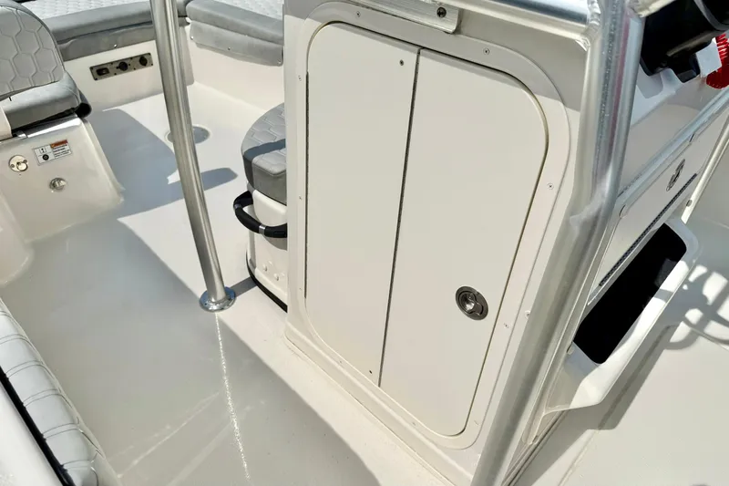 Slide: The Image of Interior view of 2026 Carolina Skiff 21 Ultra Elite boat, featuring seating and storage. - 29