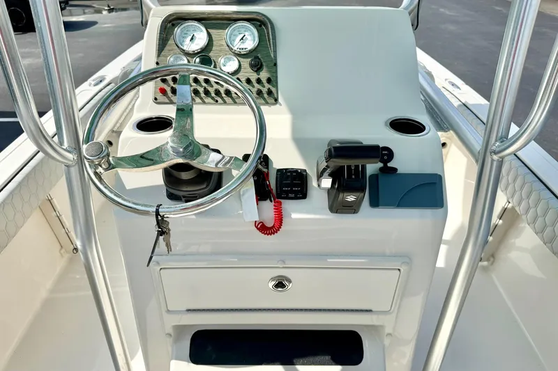 Slide: The Image of Steering console of 2026 Carolina Skiff 21 Ultra Elite boat with gauges and controls. - 3