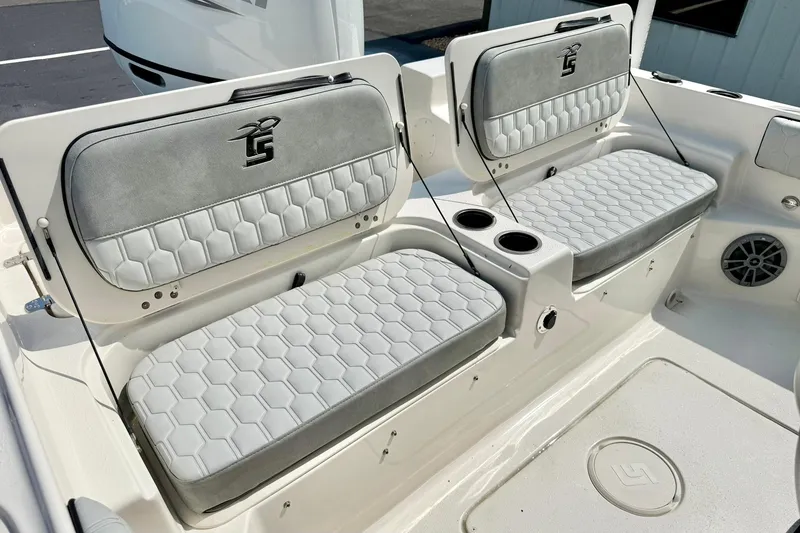 Slide: The Image of 2026 Carolina Skiff 21 Ultra Elite boat seating with stylish gray upholstery and cup holders. - 32
