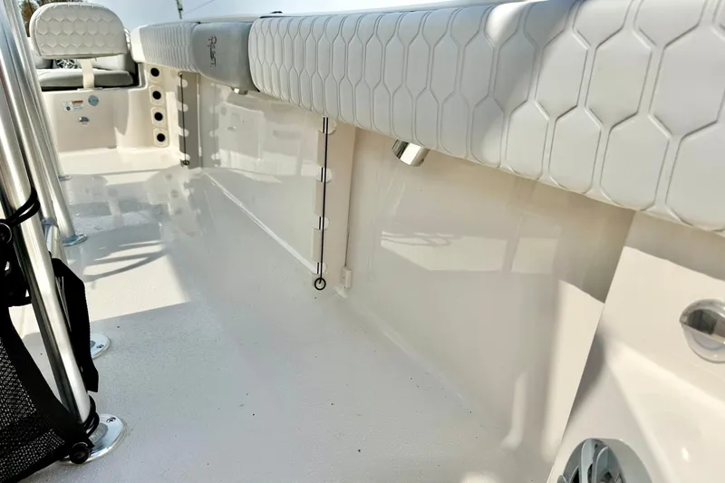 Slide: The Image of 2026 Carolina Skiff 21 Ultra Elite boat interior with cushioned seating and stainless steel fixtures. - 37
