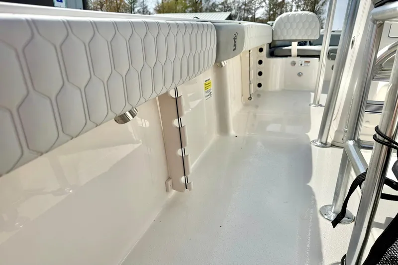 Slide: The Image of 2026 Carolina Skiff 21 Ultra Elite boat interior with cushioned seating and stainless steel fixtures. - 38