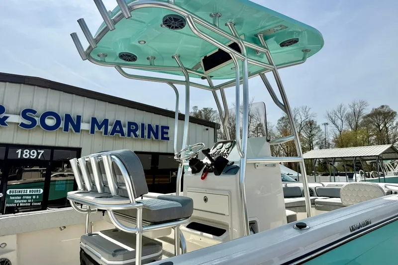 Slide: The Image of 2026 Carolina Skiff 21 Ultra Elite boat at a marine dealership. - 42