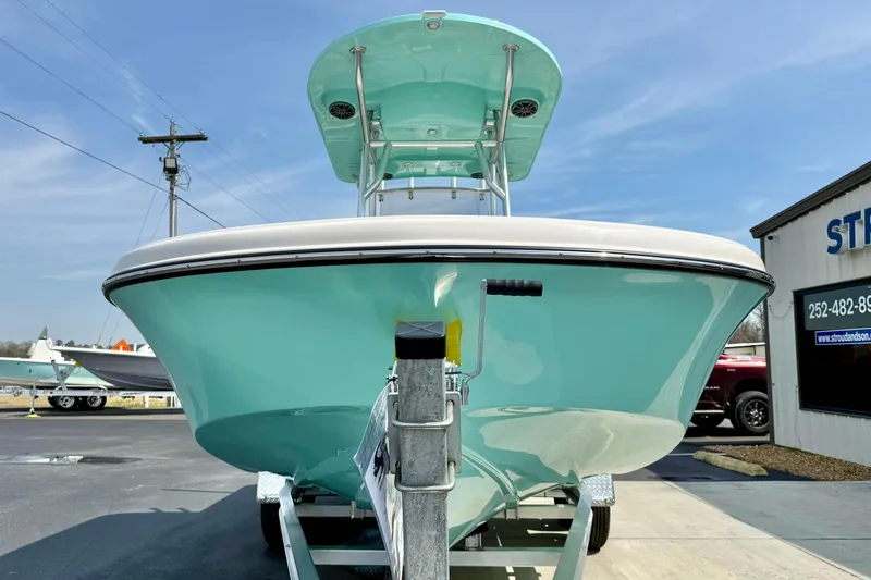 Slide: The Image of 2026 Carolina Skiff 21 Ultra Elite boat on trailer, displayed outdoors. - 8