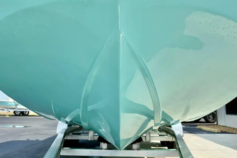 Slide: The Image of 2026 Carolina Skiff 21 Ultra Elite boat hull on trailer, showcasing sleek design. - 9