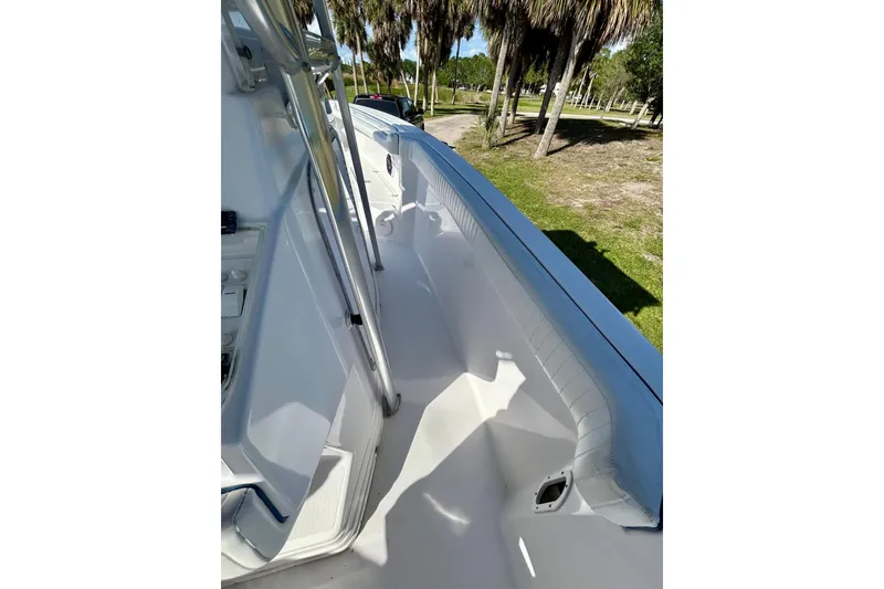 Slide: The Image of 2003 Donzi 32 ZF Open boat deck with sleek white interior and stainless steel railings. - 15