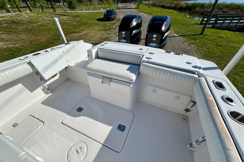 Slide: The Image of 2003 Donzi 32 ZF Open boat interior with seating and dual Mercury engines. - 16