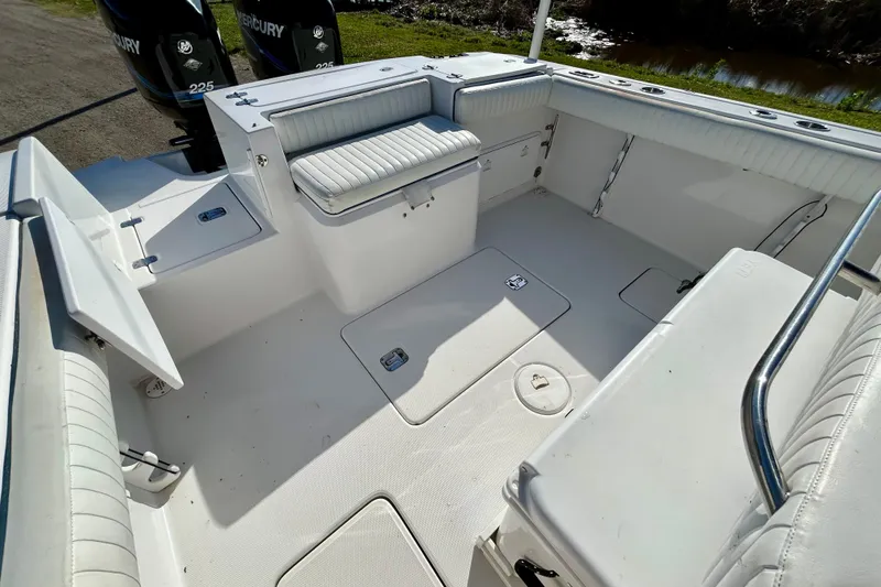 Slide: The Image of 2003 Donzi 32 ZF Open boat interior with seating and storage compartments. - 17
