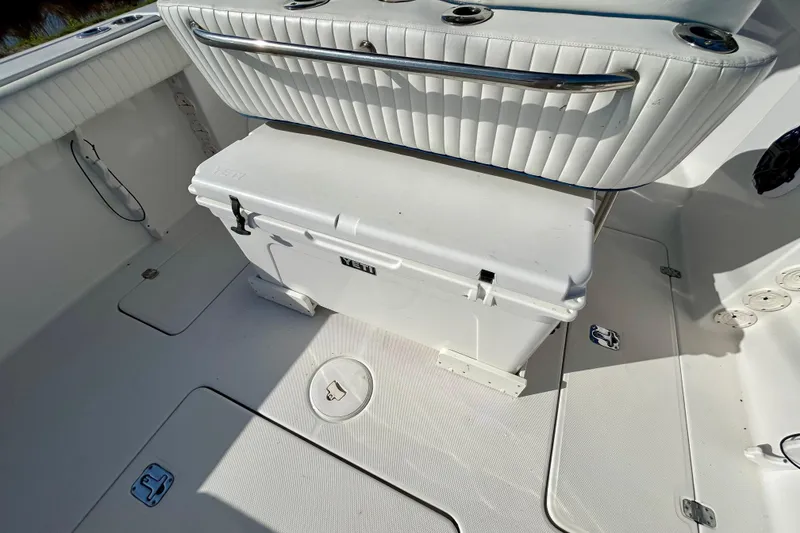 Slide: The Image of 2003 Donzi 32 ZF Open boat interior with white seating and Yeti cooler. - 19