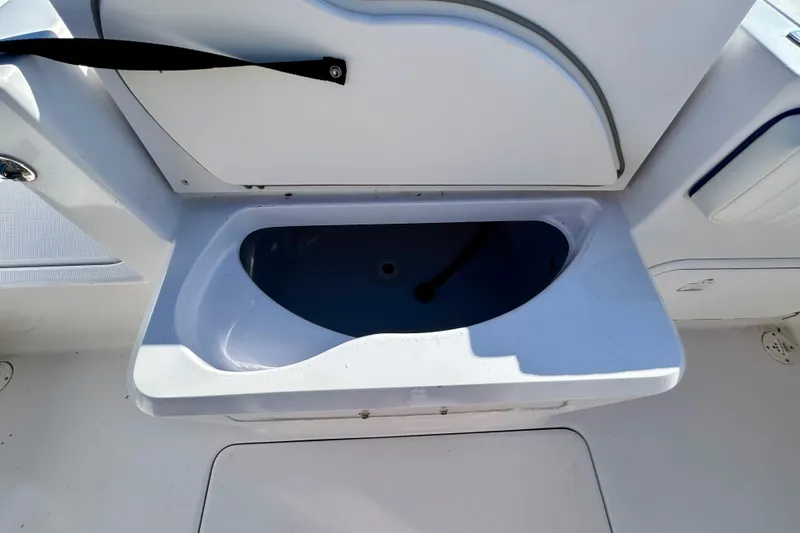 Slide: The Image of Livewell compartment on a 2003 Donzi 32 ZF Open boat, featuring a sleek white design. - 20