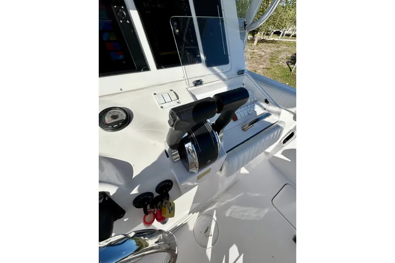 Slide: The Image of 2003 Donzi 32 ZF Open boat cockpit with controls and gauges. - 23