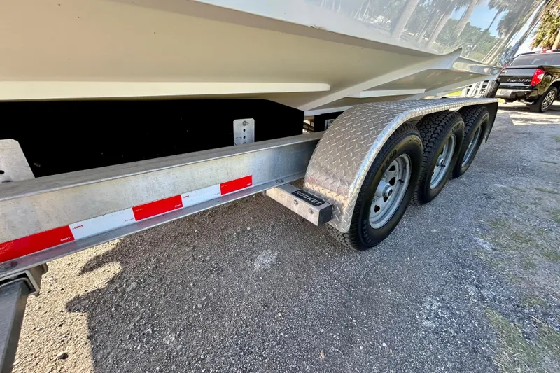 Slide: The Image of Trailer for 2003 Donzi 32 ZF Open boat with triple axles. - 24