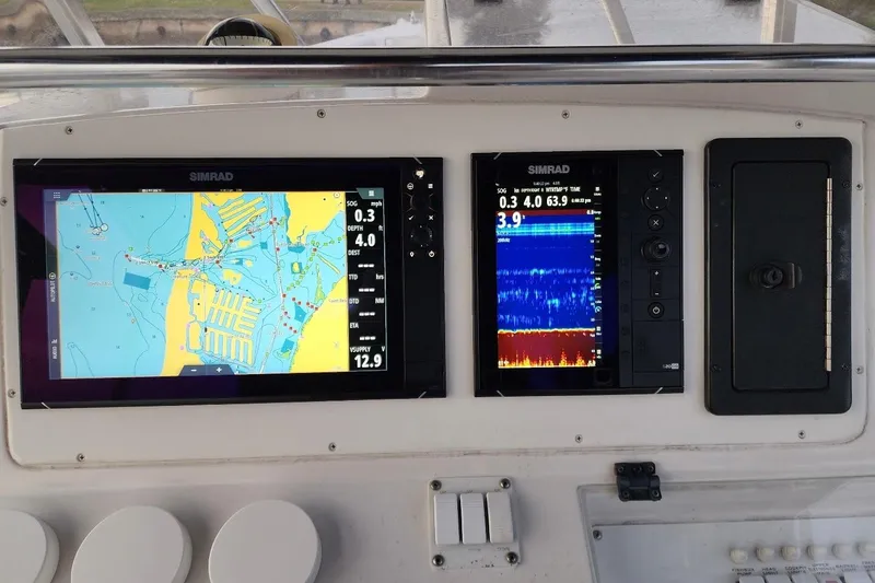 Slide: The Image of Dashboard of a 2003 Donzi 32 ZF Open with Simrad navigation displays. - 31