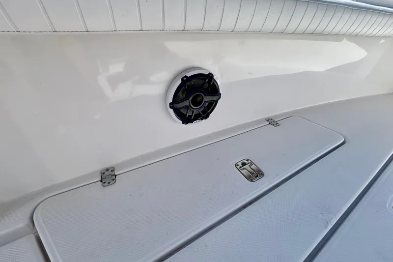 Slide: The Image of 2003 Donzi 32 ZF Open boat interior with speaker and storage compartment. - 8