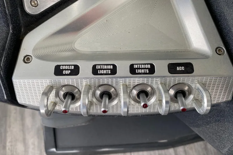 Slide: The Image of Control panel of 2021 Crest Caribbean Platinum 230 SLC with labeled switches for various functions. - 16