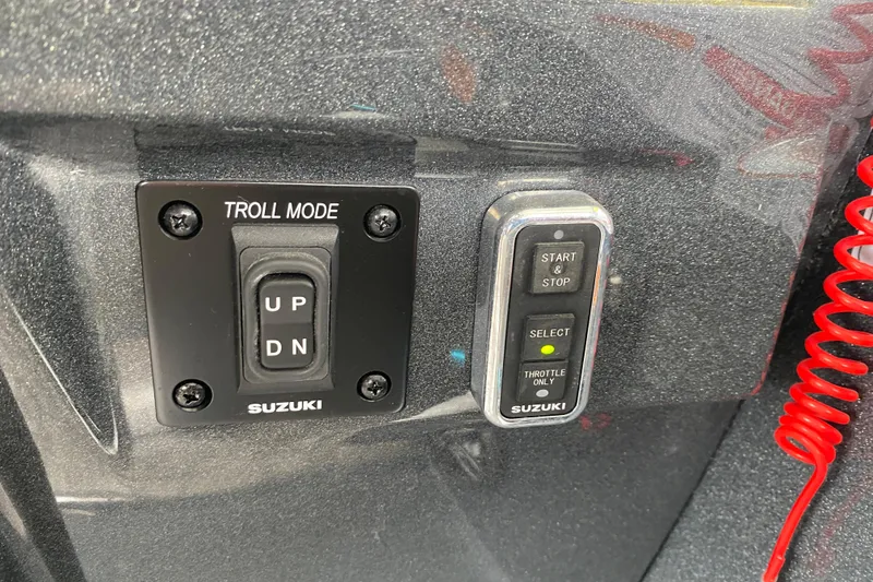Slide: The Image of Control panel of a 2021 Crest Caribbean Platinum 230 SLC with Suzuki troll mode switch. - 18