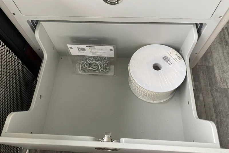 Slide: The Image of Open drawer with rope and metal hooks inside a 2021 Crest Caribbean Platinum 230 SLC. - 20