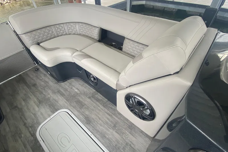 Slide: The Image of Luxurious seating on 2021 Crest Caribbean Platinum 230 SLC boat with stylish upholstery and speaker. - 22