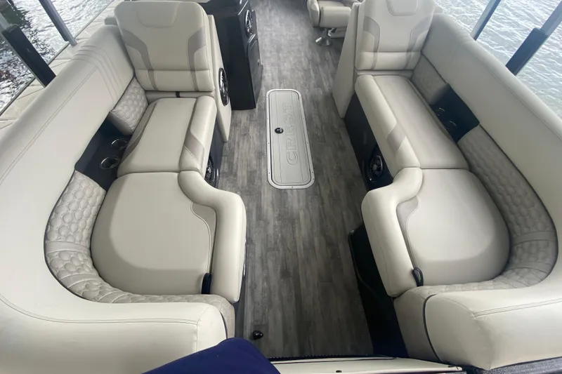 Slide: The Image of Luxurious interior of 2021 Crest Caribbean Platinum 230 SLC pontoon boat with plush seating. - 24