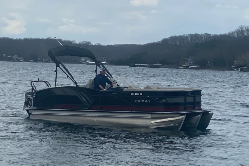 Slide: The Image of 2021 Crest Caribbean Platinum 230 SLC pontoon boat on a lake. - 5
