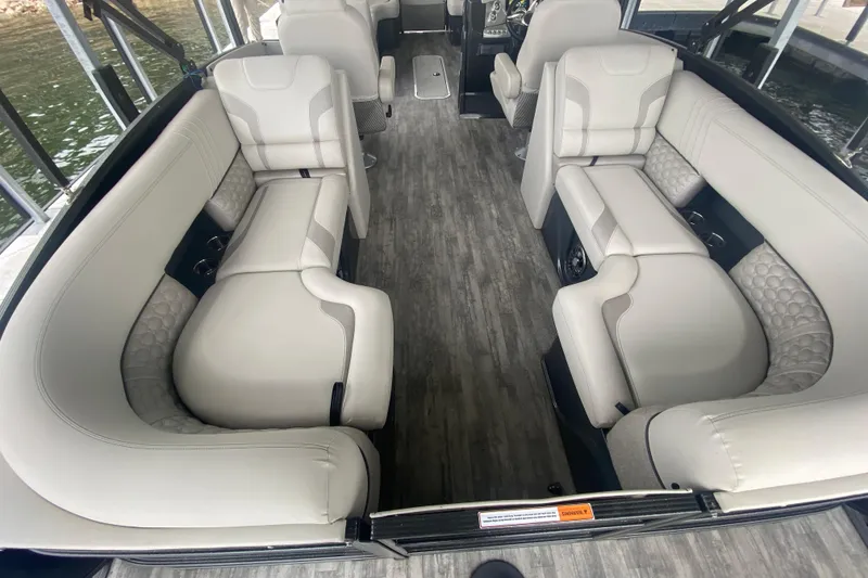Slide: The Image of Luxurious interior of 2021 Crest Caribbean Platinum 230 SLC pontoon boat with plush seating. - 8