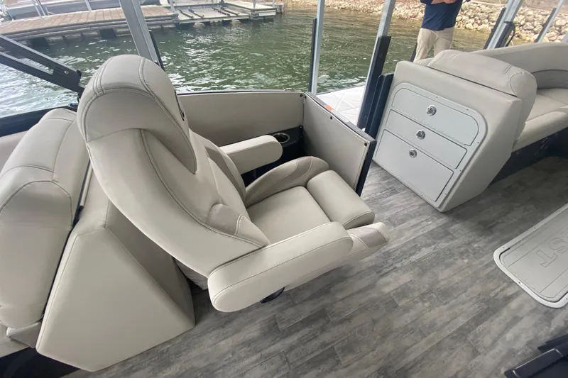 Slide: The Image of Luxurious seating on 2021 Crest Caribbean Platinum 230 SLC boat, featuring elegant interior design. - 9