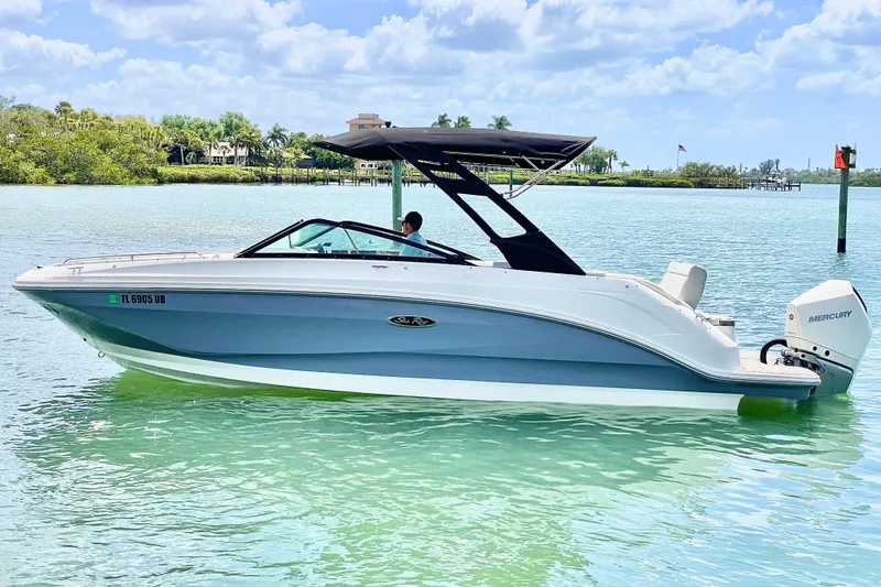 The Image of 2024 Sea Ray SDX 250 Outboard boat on clear turquoise water under a sunny sky. - 0
