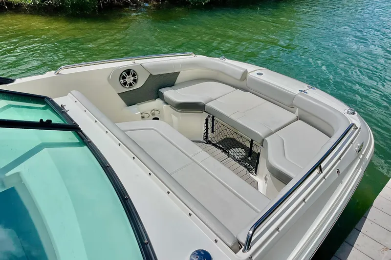 Slide: The Image of 2024 Sea Ray SDX 250 Outboard boat interior with spacious seating and water view. - 14
