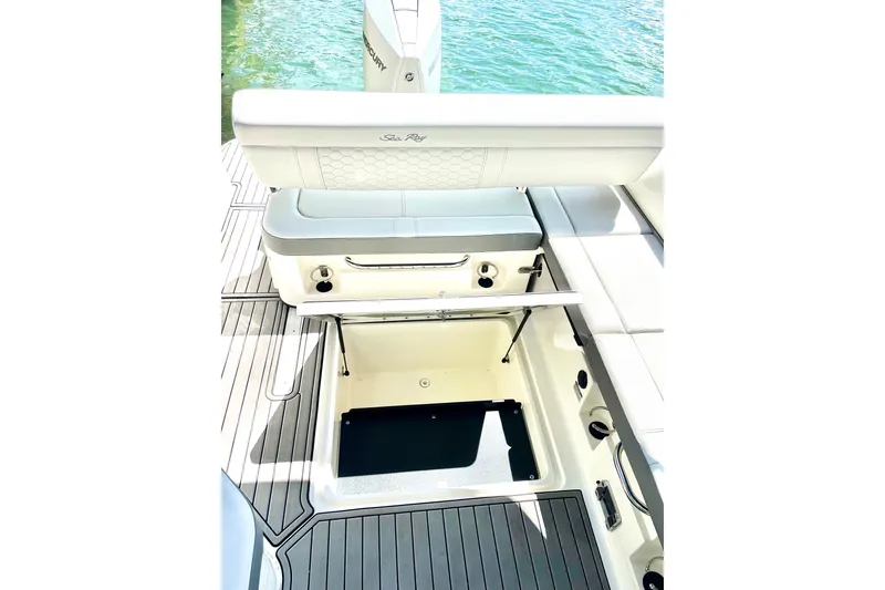 Slide: The Image of 2024 Sea Ray SDX 250 Outboard boat interior with open storage compartment. - 15