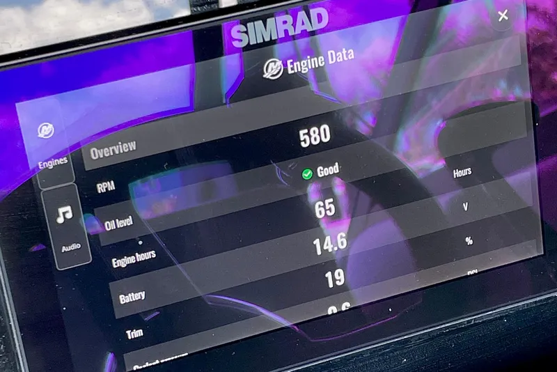 Slide: The Image of Simrad engine data display on 2024 Sea Ray SDX 250 Outboard, showing RPM and oil level. - 18